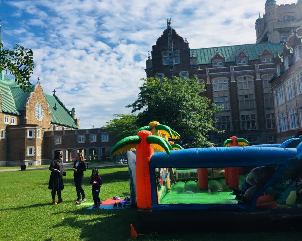 Kids play on inflatable play structure at Loyola campus